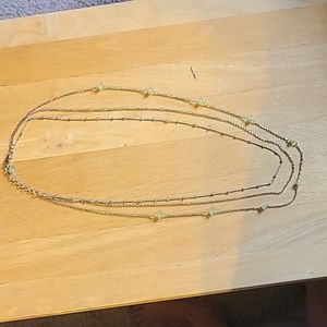3 layer gold necklace with light green bead